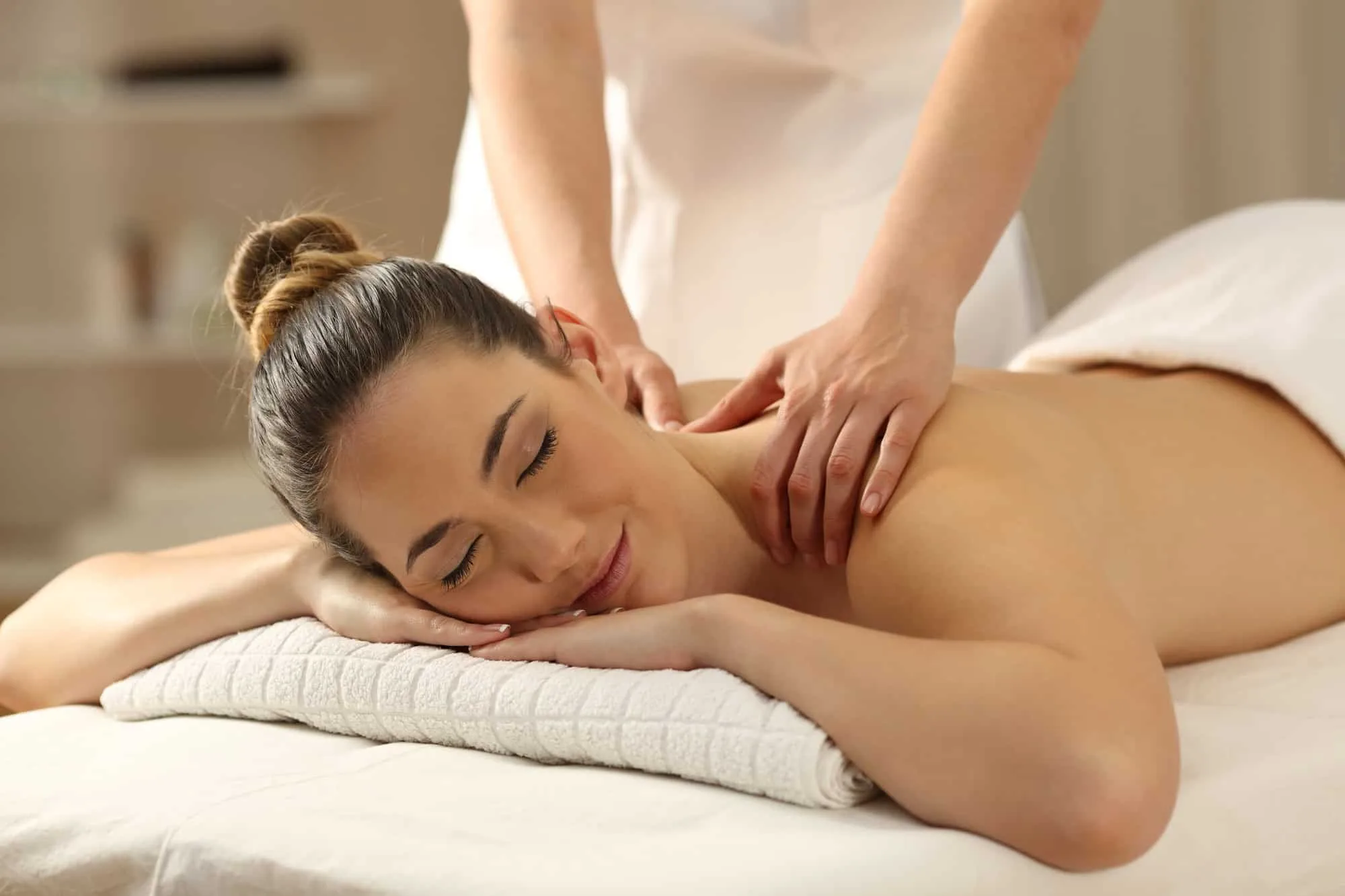 Guest receiving a relaxing massage at Club Delight